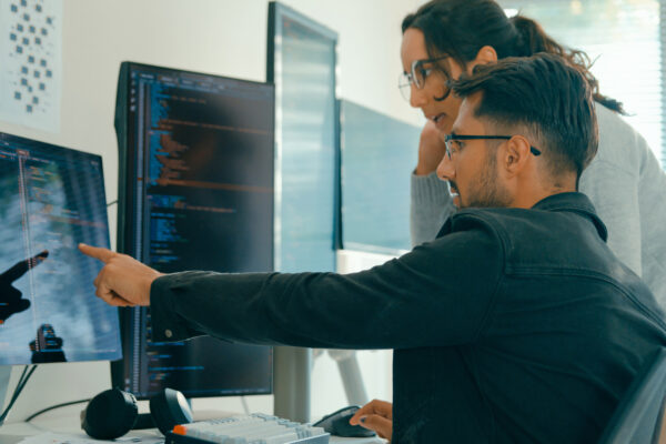 Tech Team Professionals Collaborate Discuss Software Development Strategies In Modern Office. Software Developer, Artificial Intelligence And Programming.