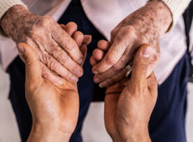 Close Up Of A Caregiver Holding Hands Senior Woman Patient