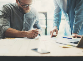 Coworkers Team Brainstorming Process In Modern Office.project Manager Wearing