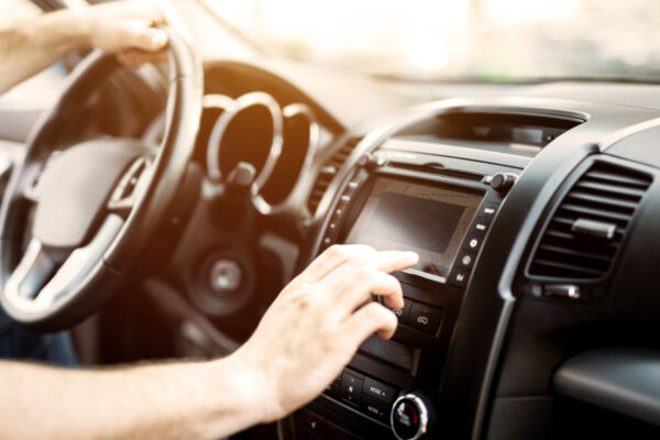 Man Using Navigation System While Driving Car