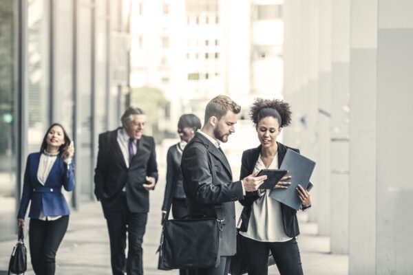 Business People Standing In Street And Discussing