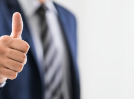 Business Man Shows Thumb Up Sign Gesture.