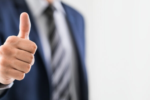 Business Man Shows Thumb Up Sign Gesture.