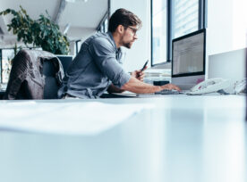 Young Businessman In Office Working On Computer