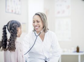 A nurse treats a young patient