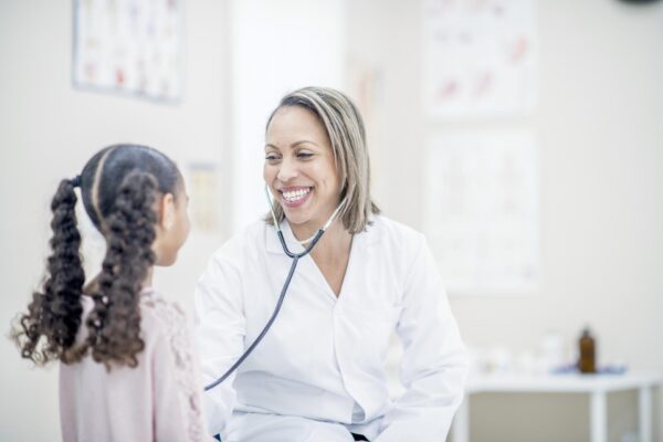 A nurse treats a young patient