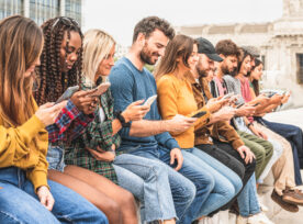 Large Group Of People Sitting Outdoor And Looking At Smart Phones, Social Network And Media Addicted Young Person Concept