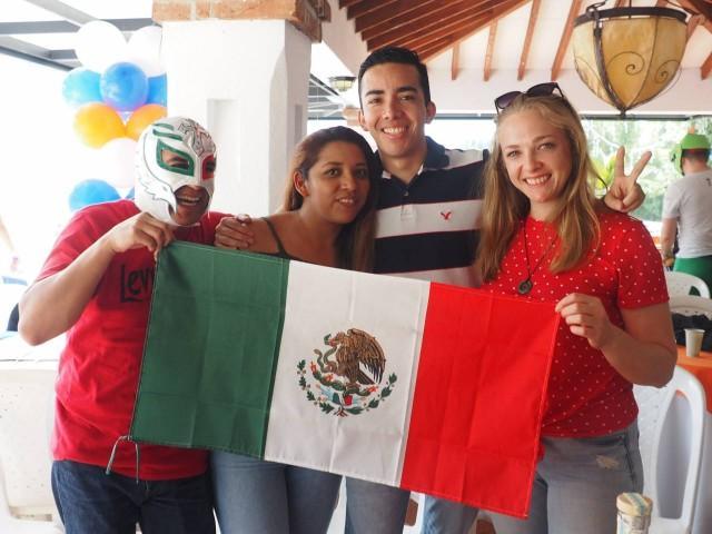 Perficient Latin America employees holding Mexico flag during celebration