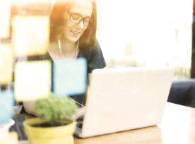 Woman Using Laptop, Smiling