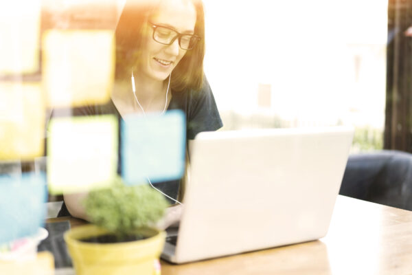 Woman Using Laptop, Smiling