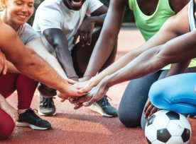 Multi Ethnic Friends Stacking Hands