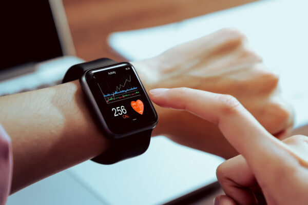 Close Up Of Hand Touching Smartwatch With Health App On The Screen, Gadget For Fitness Active Lifestyle.