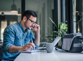 Focused Adult Man, Making A Schedule For Work.