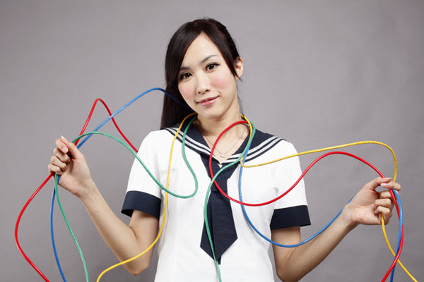 Woman Trying to Manage Multiple Wires Wrapped Around Her – Project Dependencies