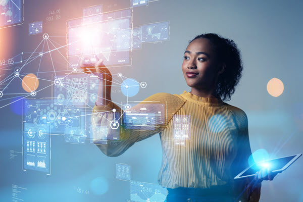 Woman working with graphs and coding on holographic screen