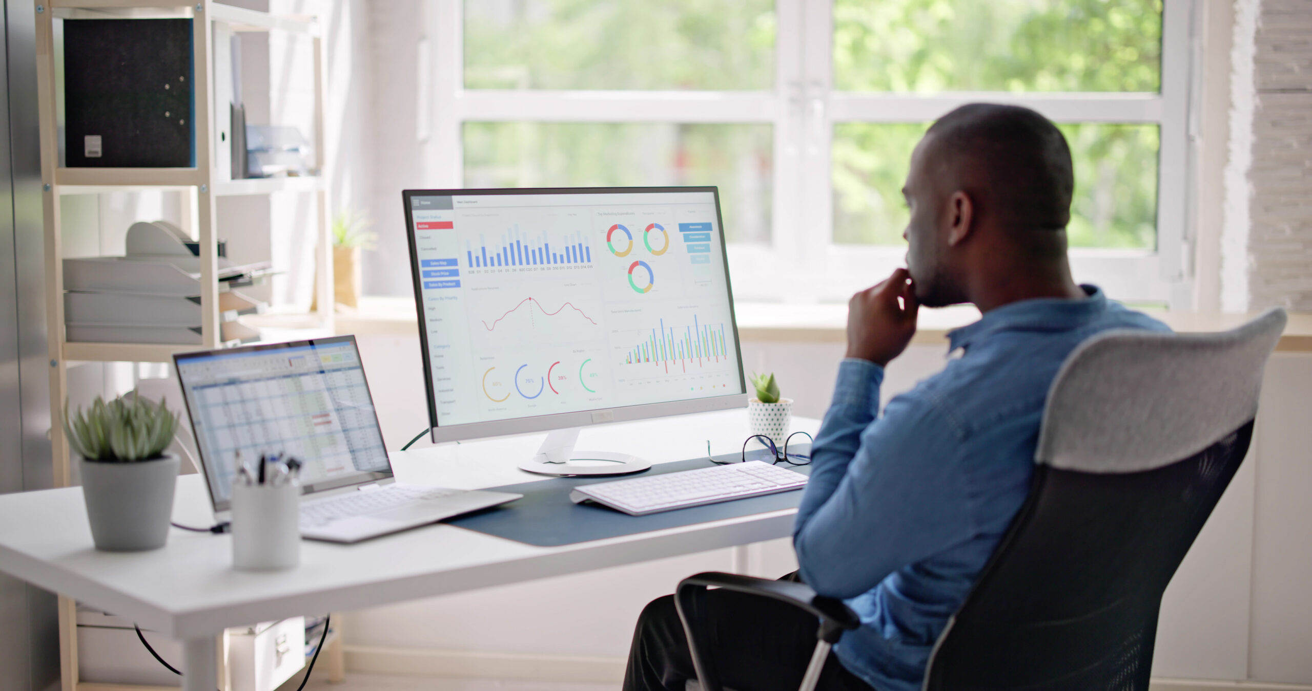 African Businessman Using Analytics Data Kpi Dashboard