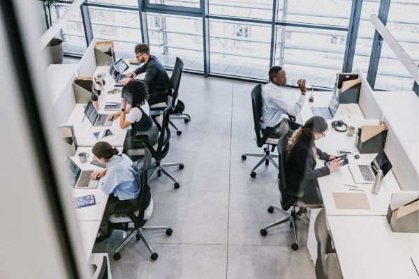 Sales and marketing team members working together with a Salesforce lead-to-revenue management solution.