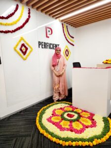 Aadela Nishat in front of Perficient sign